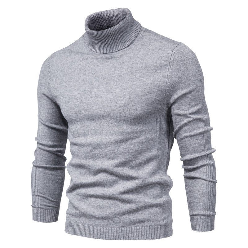 A sleek, heather gray turtleneck sweater with ribbed cuffs and hem