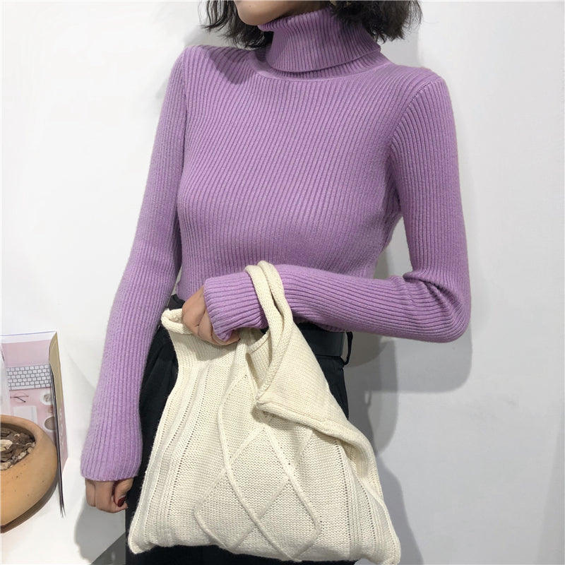 A soft lavender ribbed knit turtleneck sweater with long sleeves