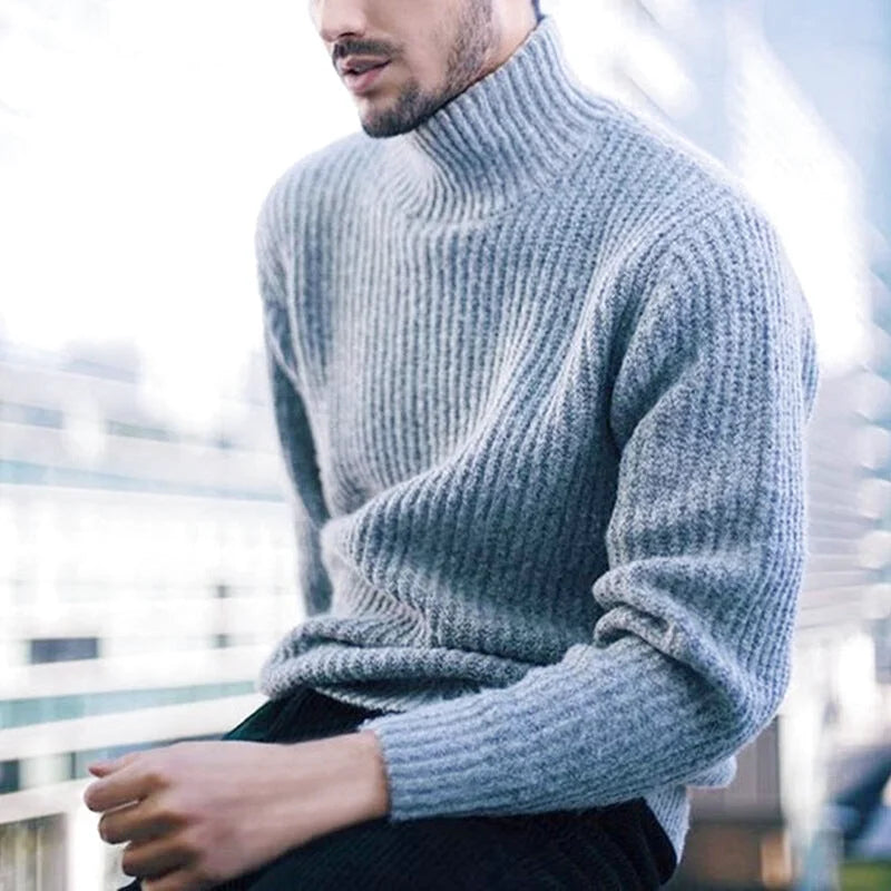 A cozy, ribbed-knit turtleneck sweater in a soft gray hue