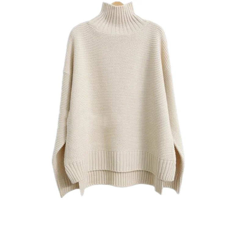 Cream-colored, ribbed-knit turtleneck sweater with a loose fit and side slits