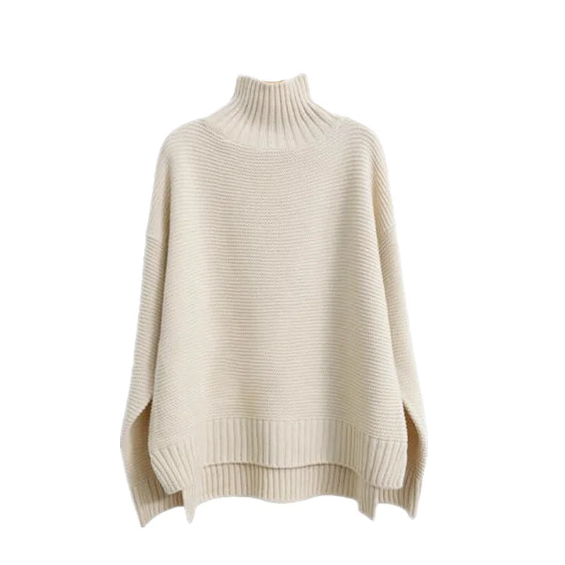 Cream-colored, ribbed-knit turtleneck sweater with a loose, oversized fit and side slits