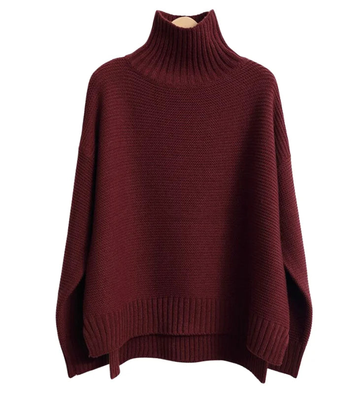 A cozy, deep burgundy turtleneck sweater with a loose, oversized fit and ribbed cuffs