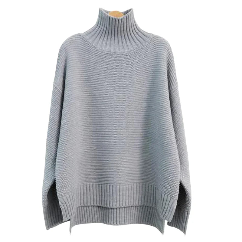 A soft, light gray ribbed knit turtleneck sweater with a relaxed fit and asymmetrical hem