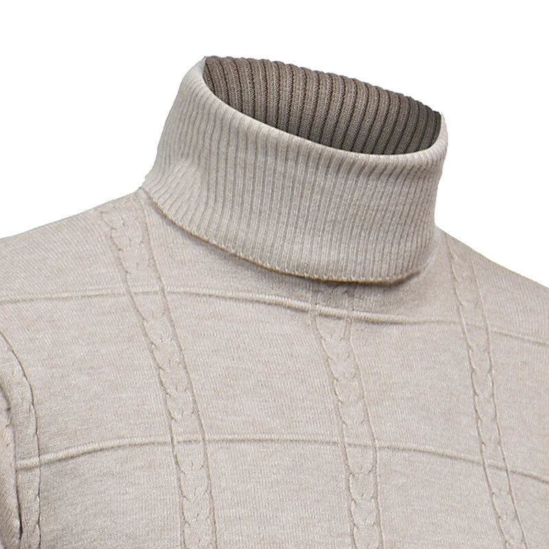 A beige turtleneck sweater with a ribbed collar and cable-knit pattern across the chest