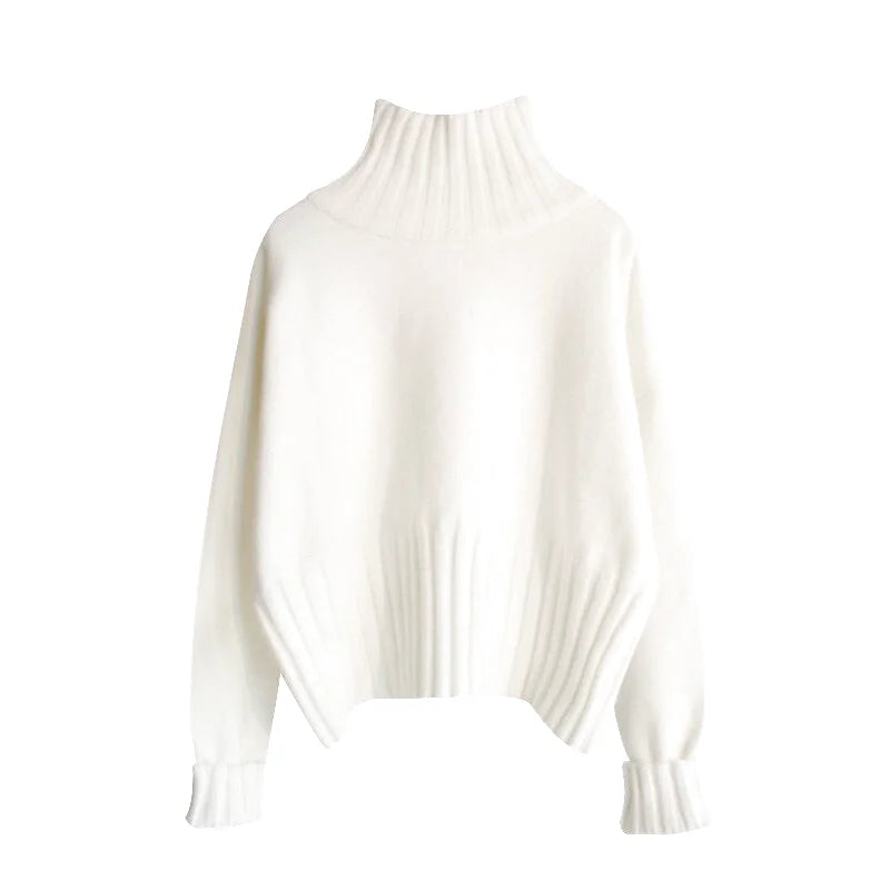 A soft, off-white knit sweater with a ribbed turtleneck and long sleeves