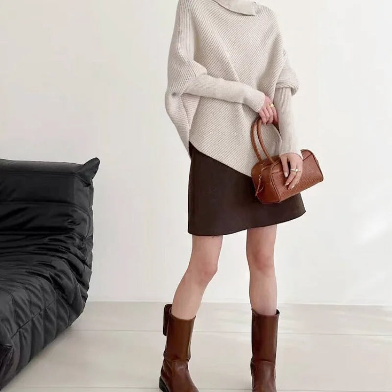 Beige ribbed knit turtleneck sweater with loose, balloon sleeves
