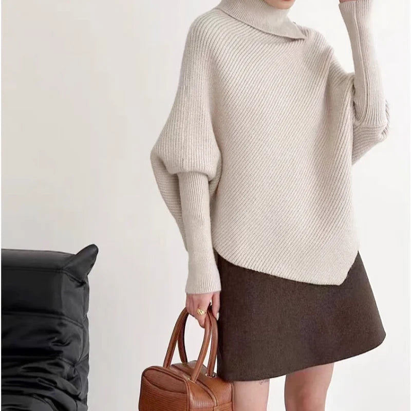 Beige ribbed knit turtleneck sweater with loose, balloon sleeves