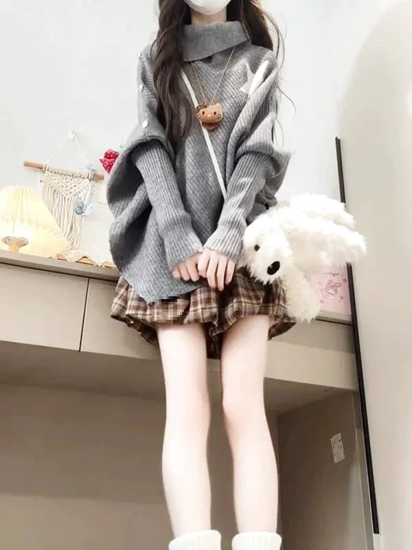 Gray ribbed knit sweater with a high collar and loose, oversized fit