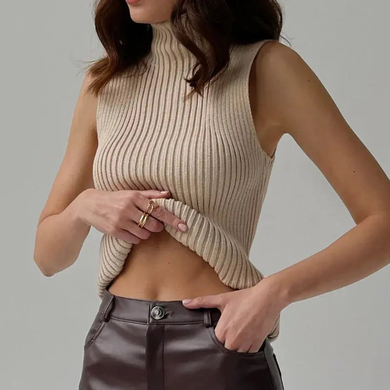 Beige ribbed knit sleeveless top with a high neckline