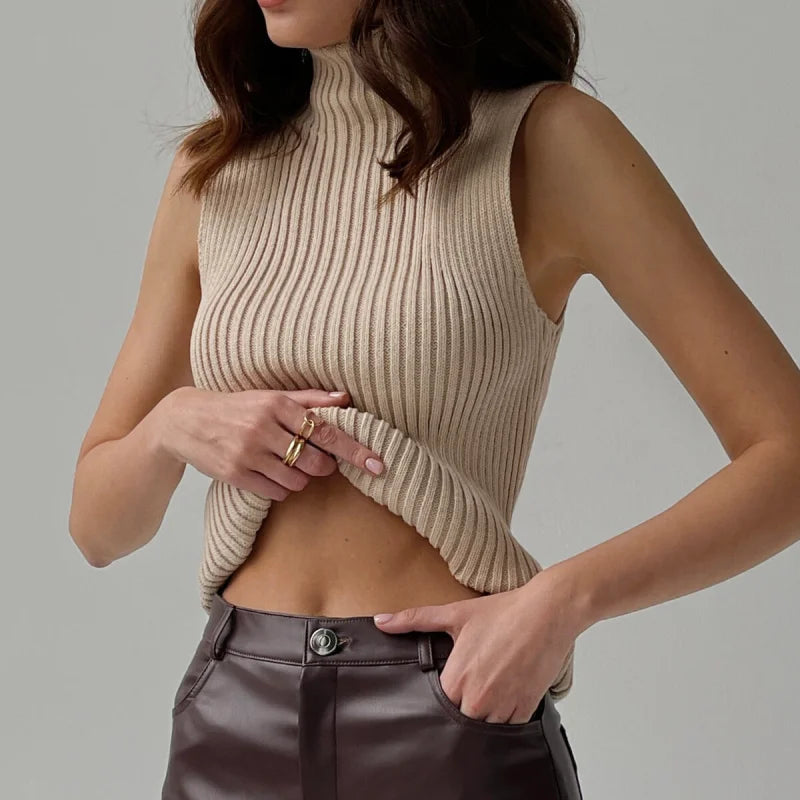 Beige ribbed knit sleeveless top with a high neckline