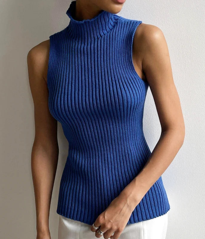 A vibrant royal blue ribbed knit sleeveless turtleneck top