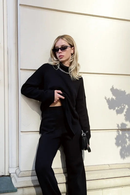 Black cropped sweater with long sleeves and a high neckline