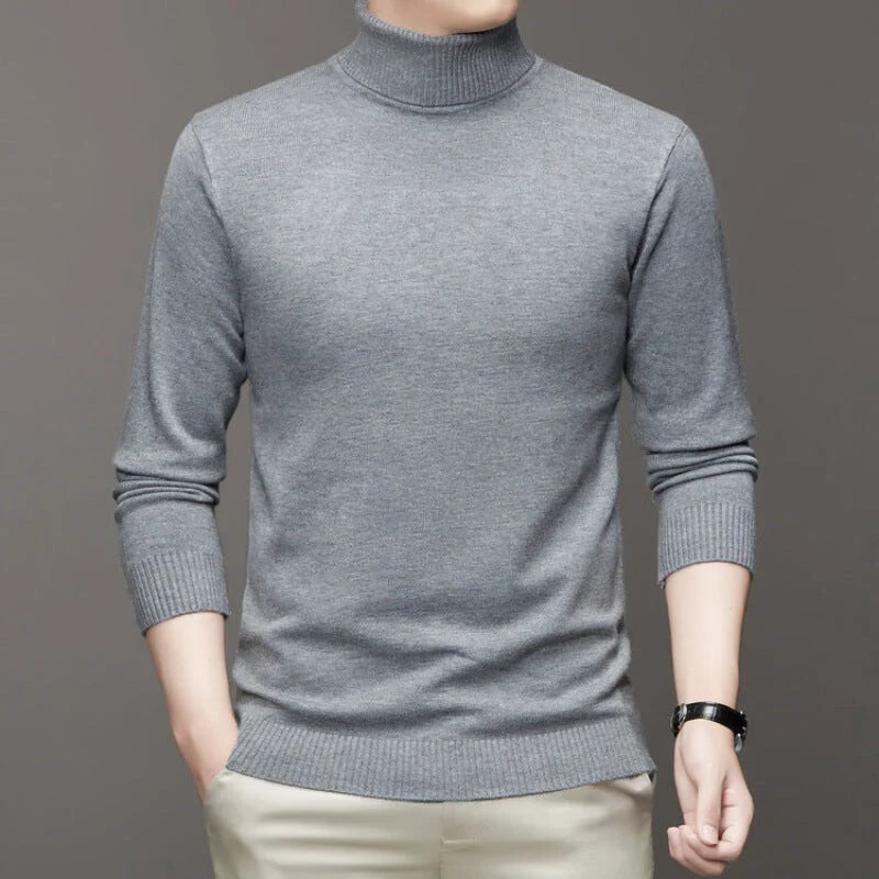 A sleek, heather gray turtleneck sweater with ribbed cuffs and hem