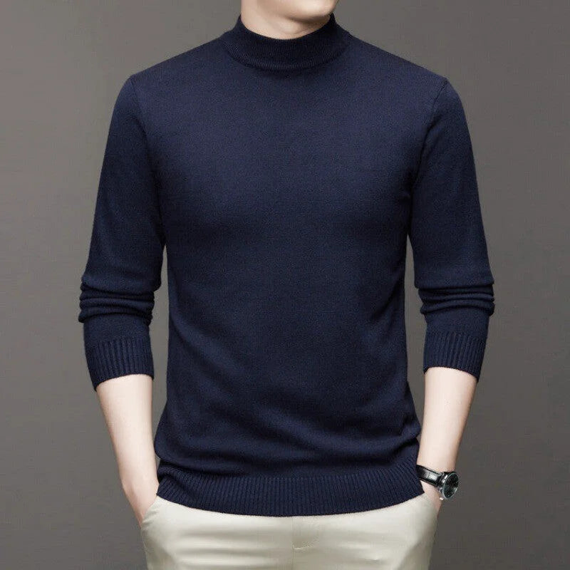Dark navy blue, long-sleeved turtleneck sweater with ribbed cuffs and hem