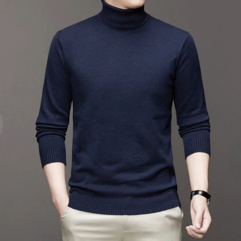 Dark navy blue, long-sleeved turtleneck sweater with ribbed cuffs and hem