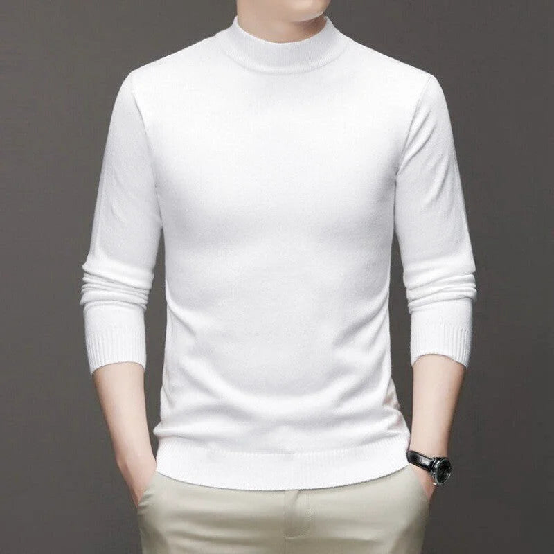 A crisp white, long-sleeved turtleneck sweater with ribbed cuffs and hem