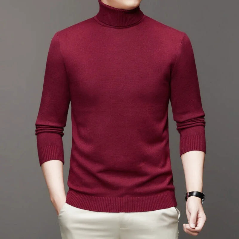 A rich burgundy turtleneck sweater with a smooth knit texture and ribbed cuffs and hem