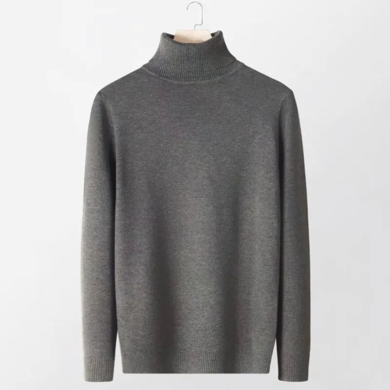 A sleek, dark gray turtleneck sweater with a ribbed collar and cuffs