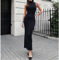 A sleek, black ribbed knit high-neck midi dress with a form-fitting silhouette and flared hem