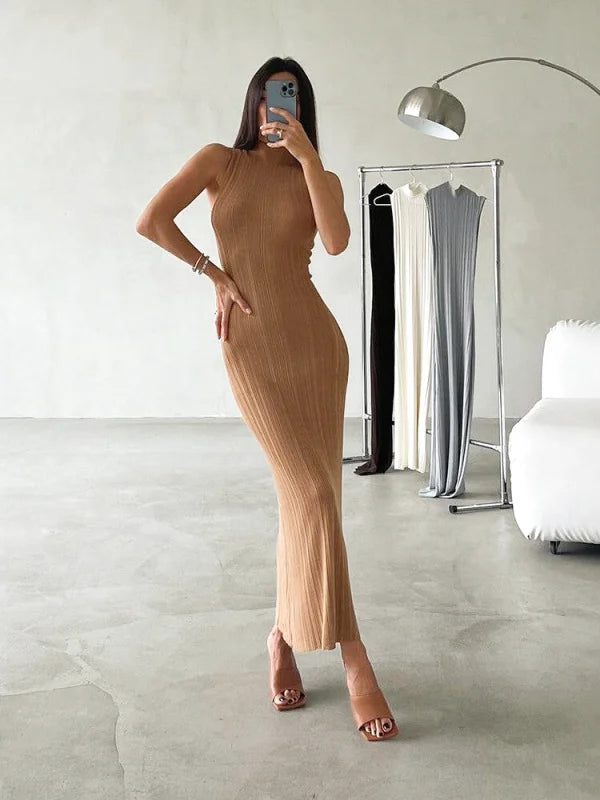 A sleek, camel-colored ribbed midi dress with a flattering high neckline and fitted silhouette