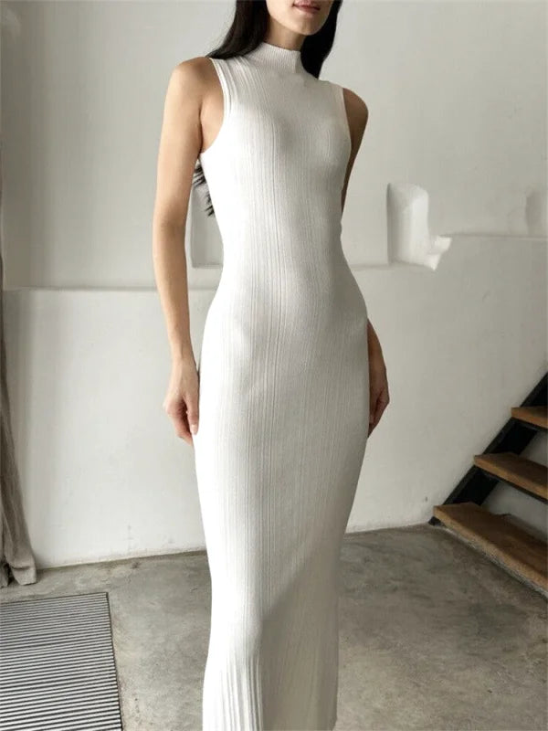 A sleek, white ribbed knit sleeveless midi dress with a high neckline