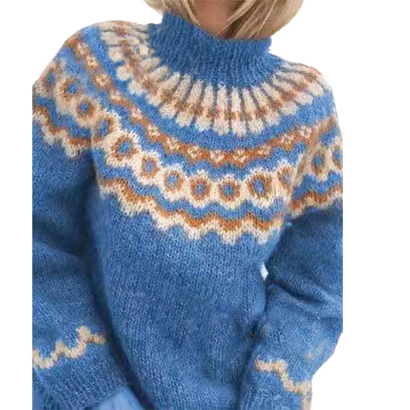 A cozy blue knit sweater featuring intricate beige and tan geometric patterns around the high neckline