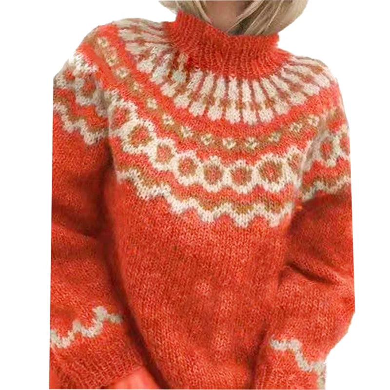 A cozy orange knit sweater with a high collar and intricate white and beige geometric patterns across the chest and sleeves