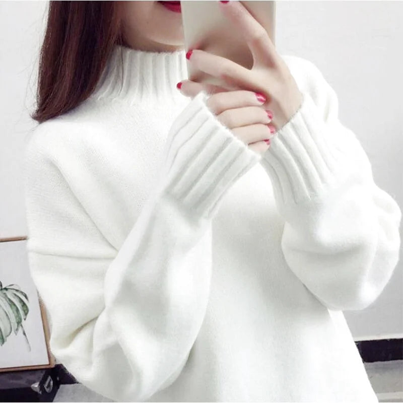 A cozy white knit sweater with ribbed cuffs and a high turtleneck