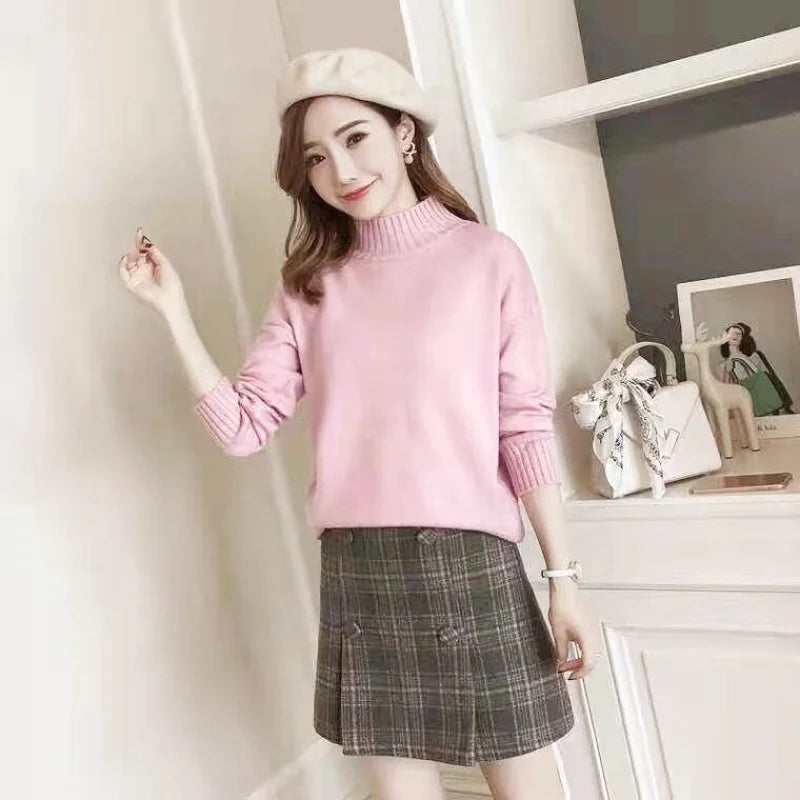 Pink high-neck sweater with ribbed cuffs and hem