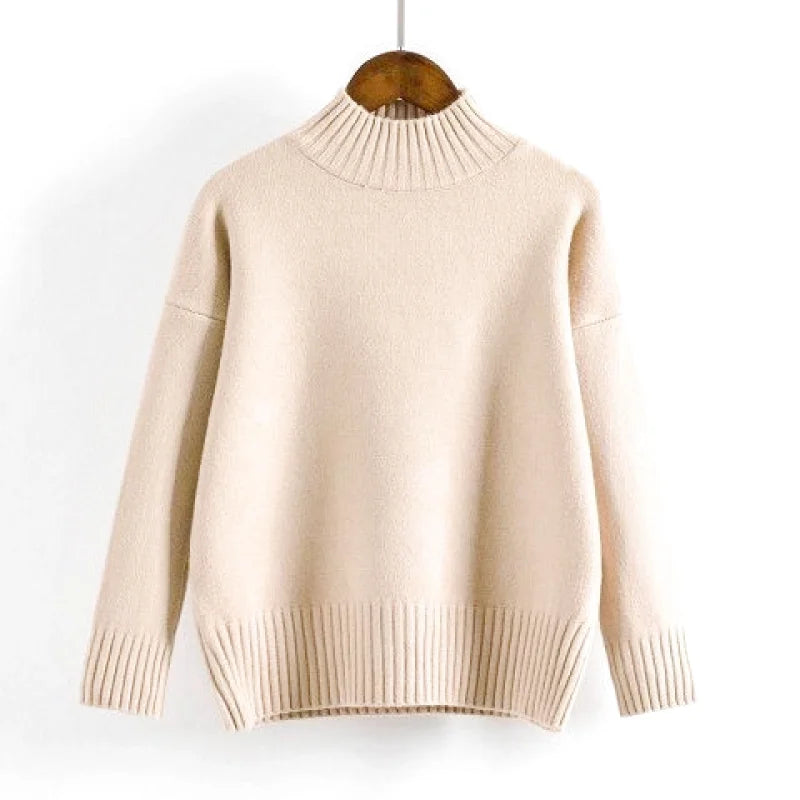 Beige ribbed turtleneck sweater with a soft, knitted texture and long sleeves