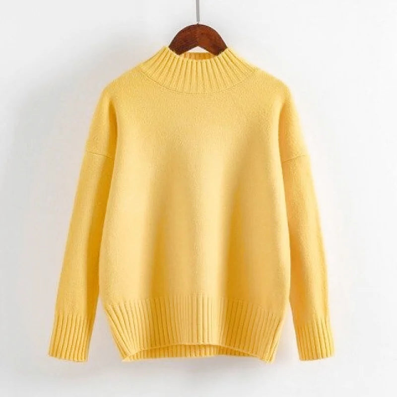 A soft yellow, long-sleeved knit sweater with a ribbed crew neckline and cuffs