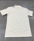 Cream-colored short-sleeved turtleneck top made of soft, stretchy fabric