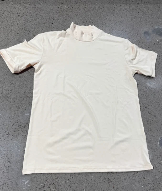 Cream-colored short-sleeved turtleneck top made of soft, stretchy fabric