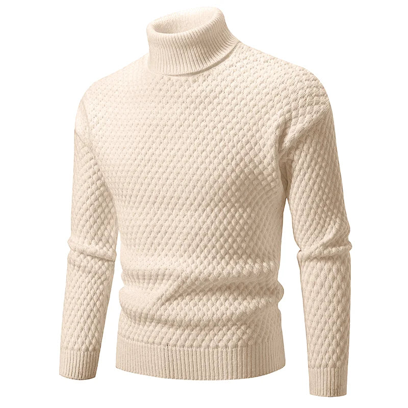 Cream-colored turtleneck sweater with a textured diamond-knit pattern and ribbed cuffs