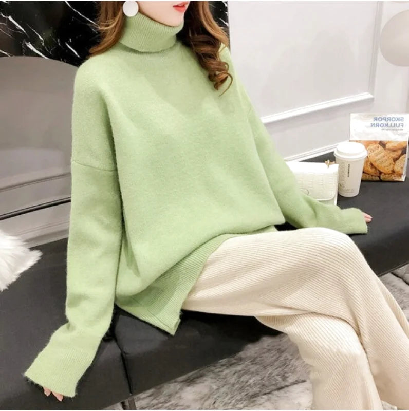 A soft mint green, oversized turtleneck sweater with a cozy knit texture