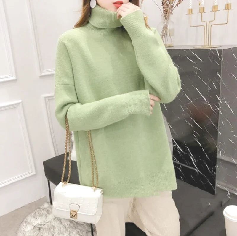 Soft mint green turtleneck sweater with long sleeves and a cozy, slightly oversized fit