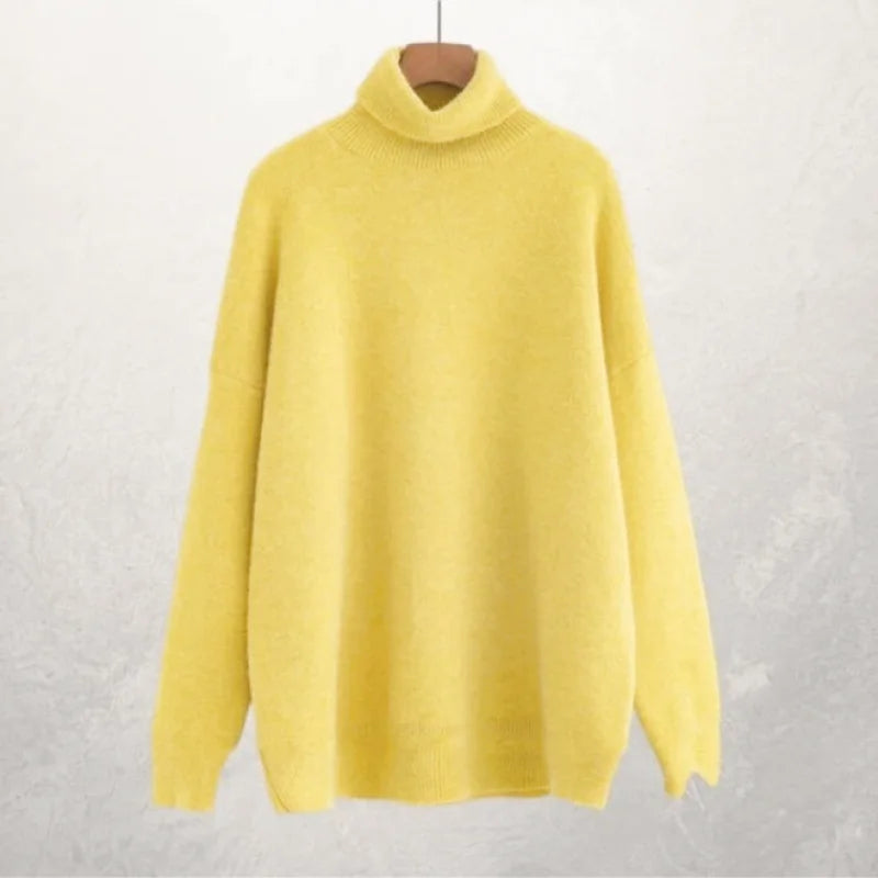 A soft, pale yellow turtleneck sweater with a cozy knit texture and long sleeves