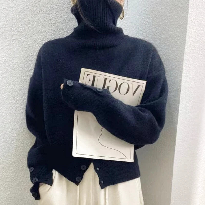 Dark navy turtleneck sweater with buttoned cuffs and a front placket