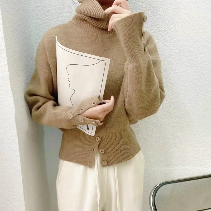 A cozy camel-colored turtleneck sweater with ribbed cuffs and a front button closure