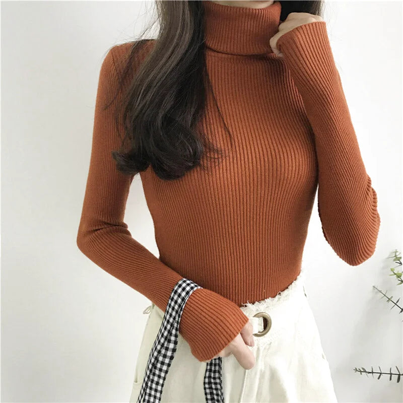A ribbed, long-sleeved turtleneck sweater in a warm rust-orange hue