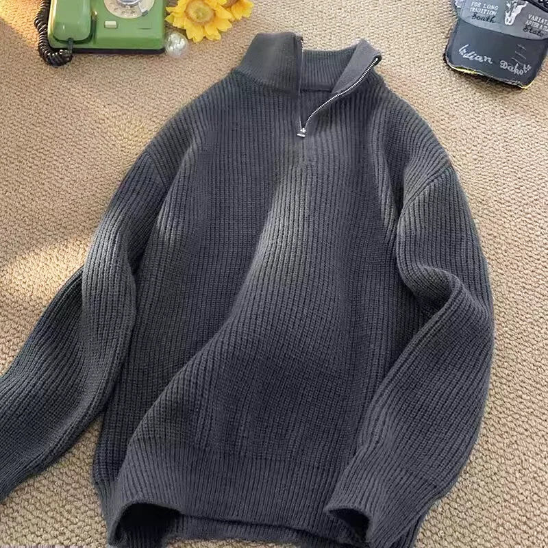 Dark gray ribbed knit sweater with a half-zip collar