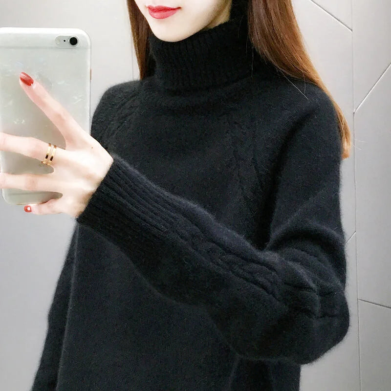 Black turtleneck sweater with ribbed cuffs and a cable-knit pattern on the sleeves