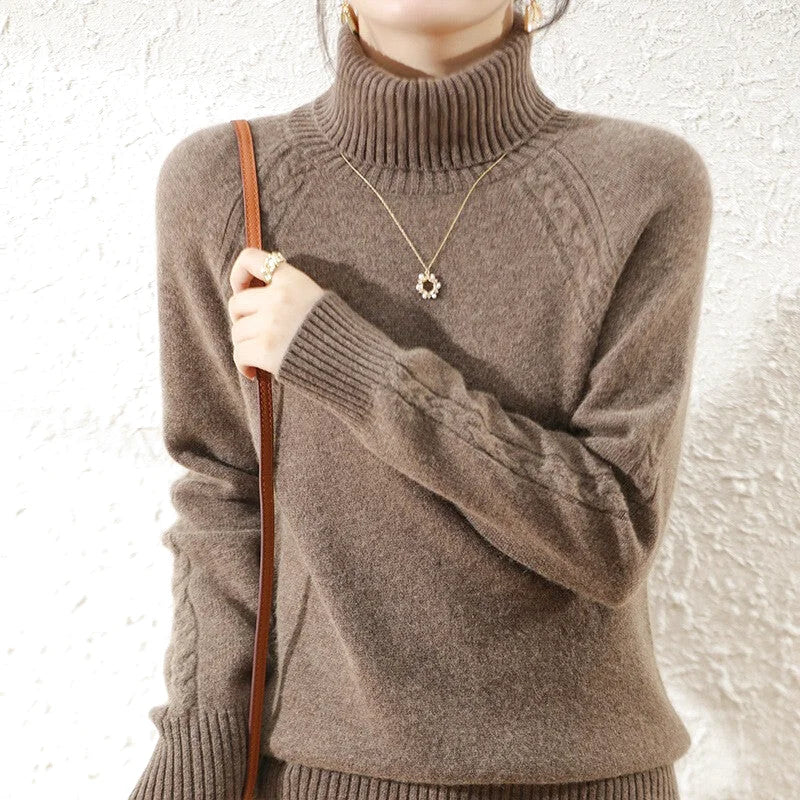 A cozy, high-necked brown knit sweater with ribbed cuffs and a textured cable-knit pattern on the sleeves
