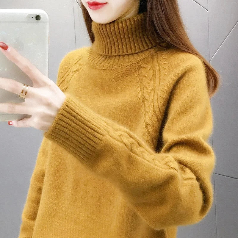 A cozy mustard-yellow turtleneck sweater with intricate cable-knit detailing on the sleeves and neckline