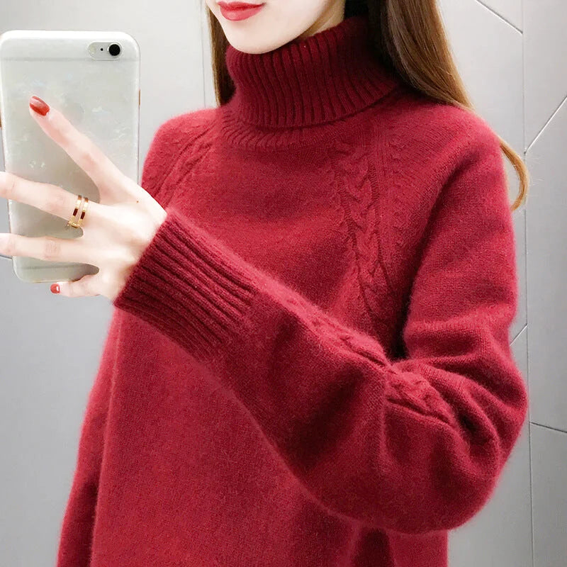 A cozy, deep red turtleneck sweater with a textured cable-knit pattern and ribbed cuffs