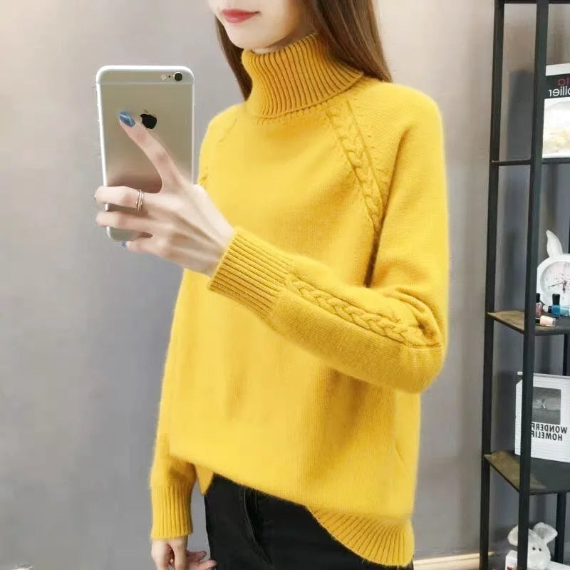 Vibrant yellow turtleneck sweater with cable-knit detailing on the sleeves and cuffs