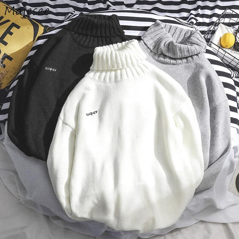 White turtleneck sweater with ribbed cuffs and a subtle ’super’ embroidery on the chest