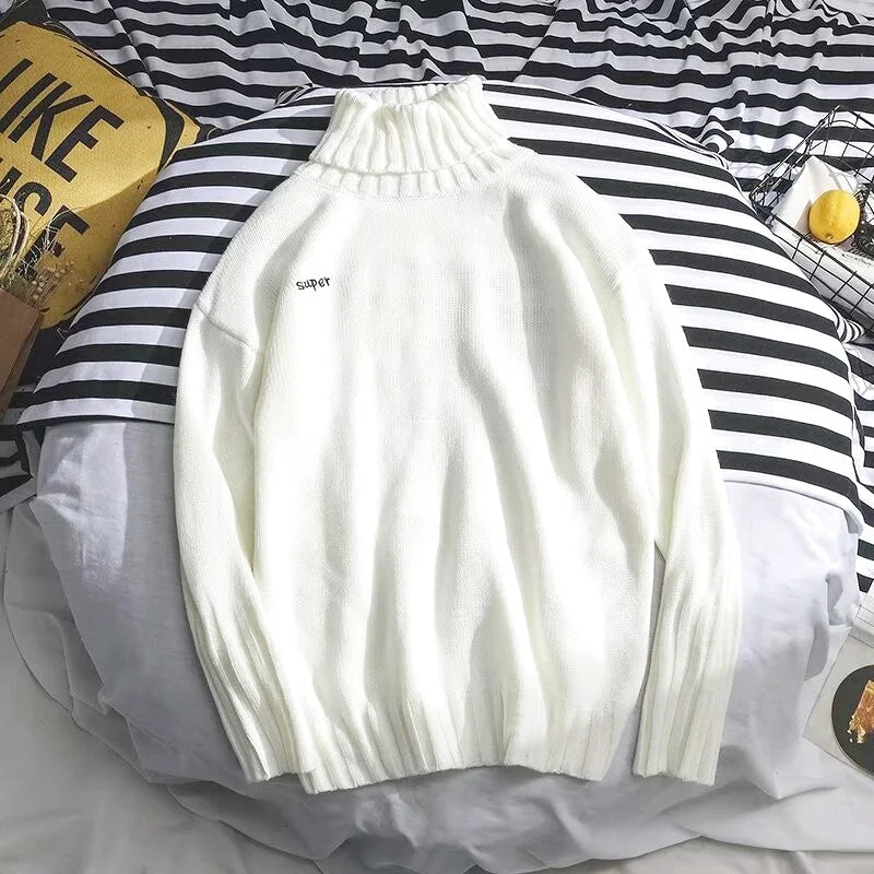 White ribbed turtleneck sweater with ’super’ embroidered in black on the chest